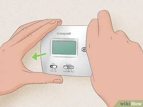 how to change battery on honeywell thermostat