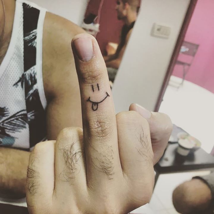 smiley tattoo finger