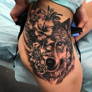 tatuajes de lobo para mujer en la pierna