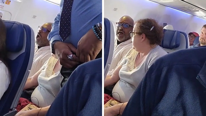 woman sees something on plane