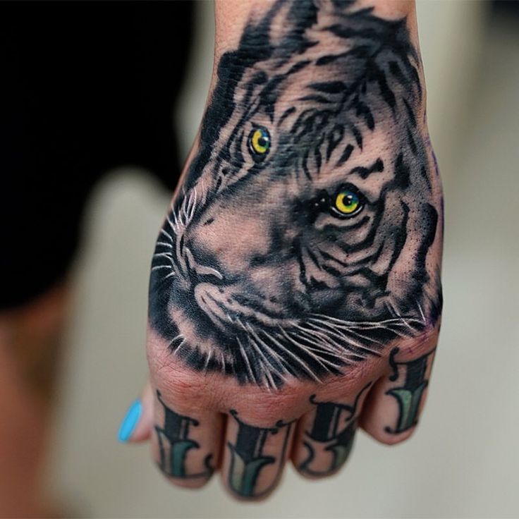 tiger face tattoo on hand