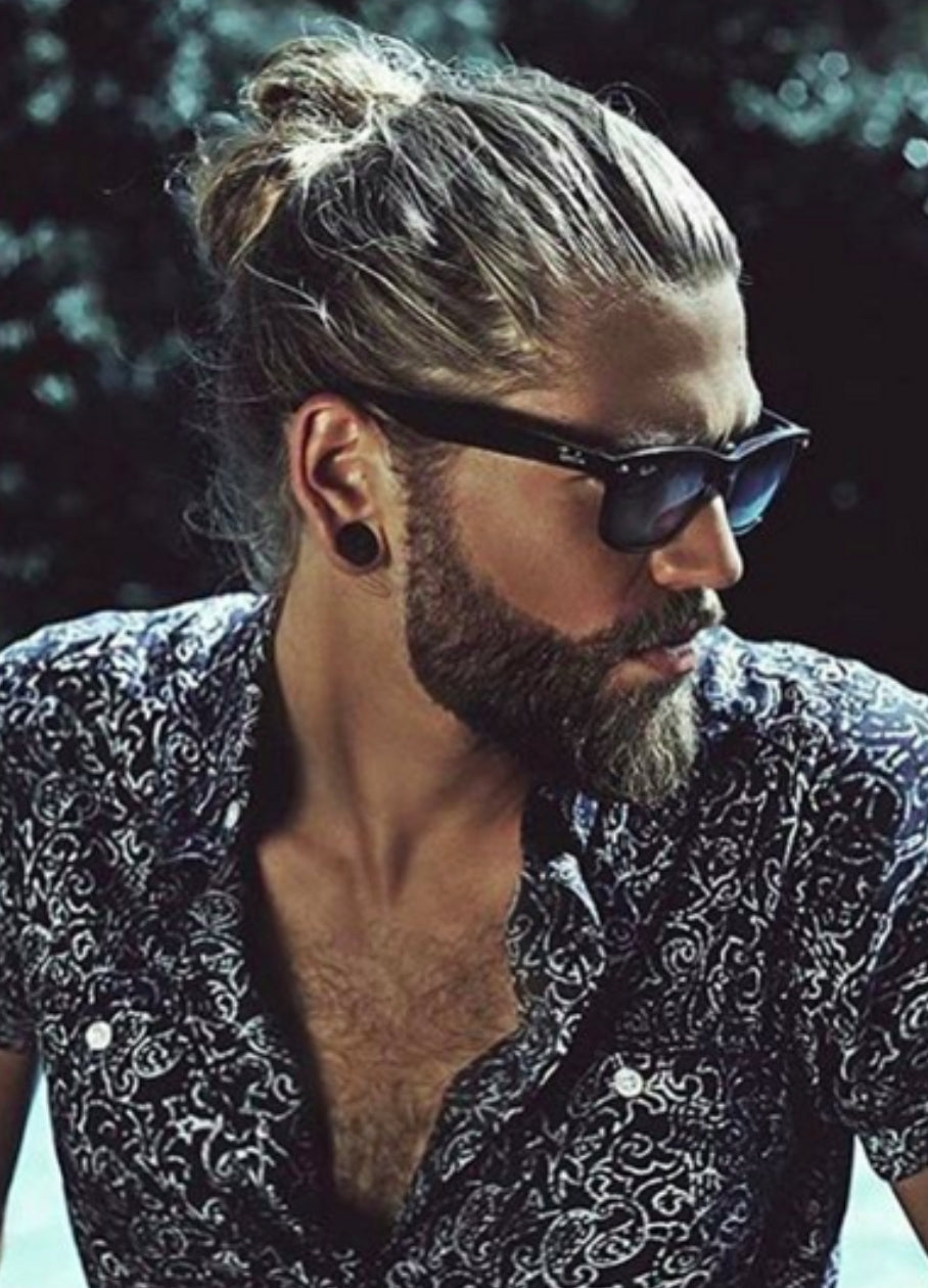 man bun hairstyle with beard