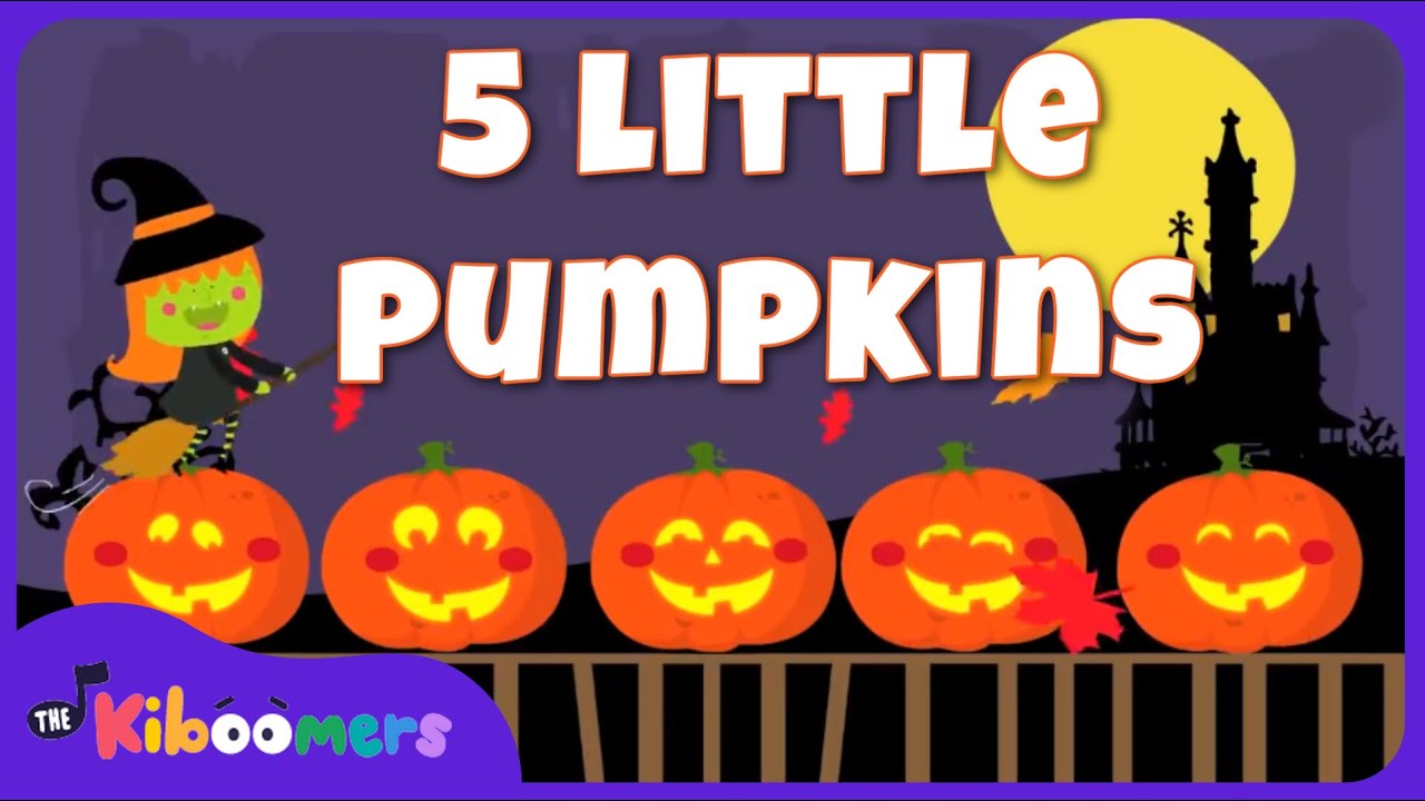 5 pumpkins sitting on a gate