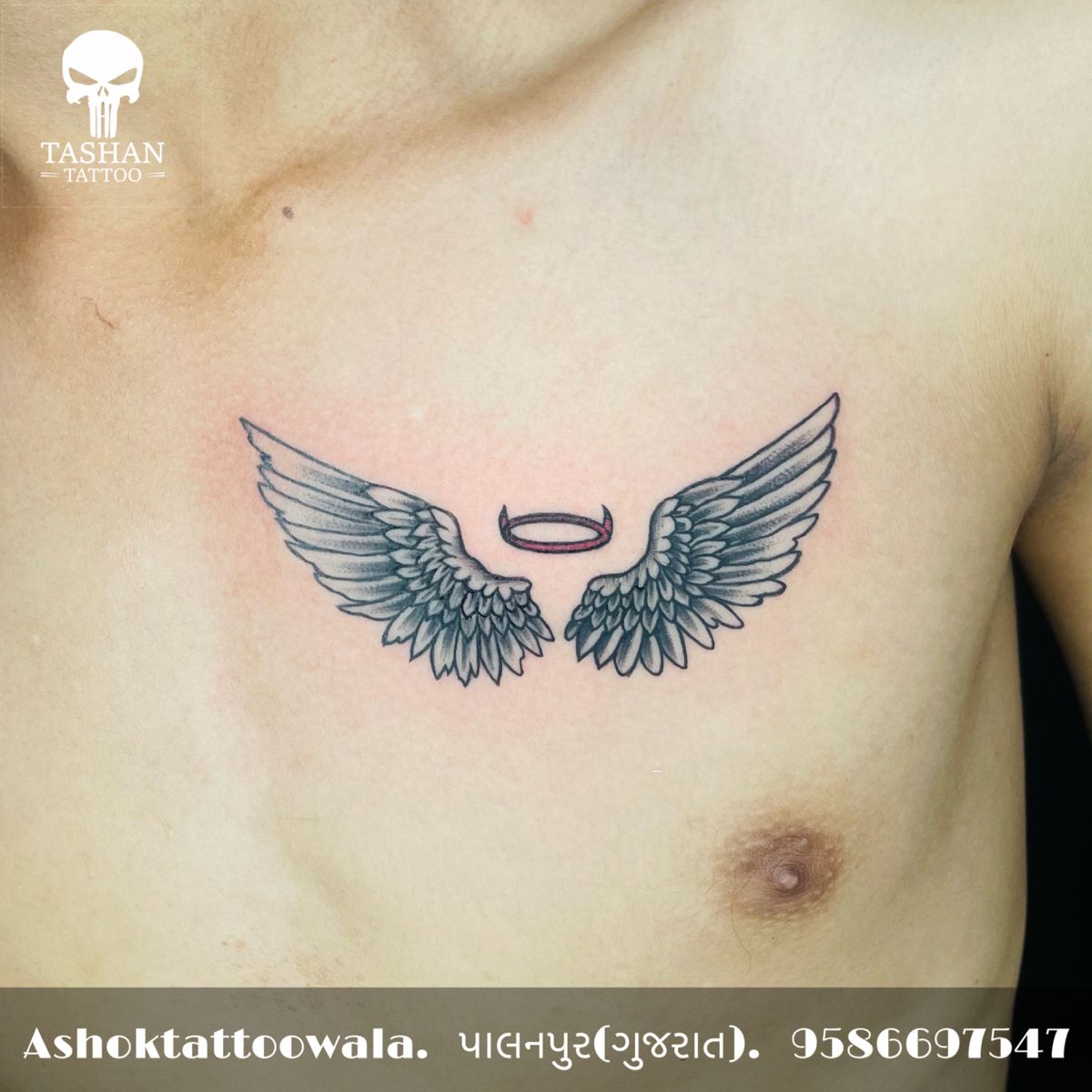 small wings tattoo on chest