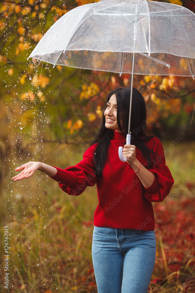 a girl with umbrella in rain