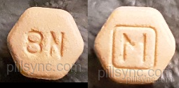 orange hexagon suboxone pill with m on it