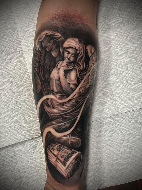 angel on forearm tattoo