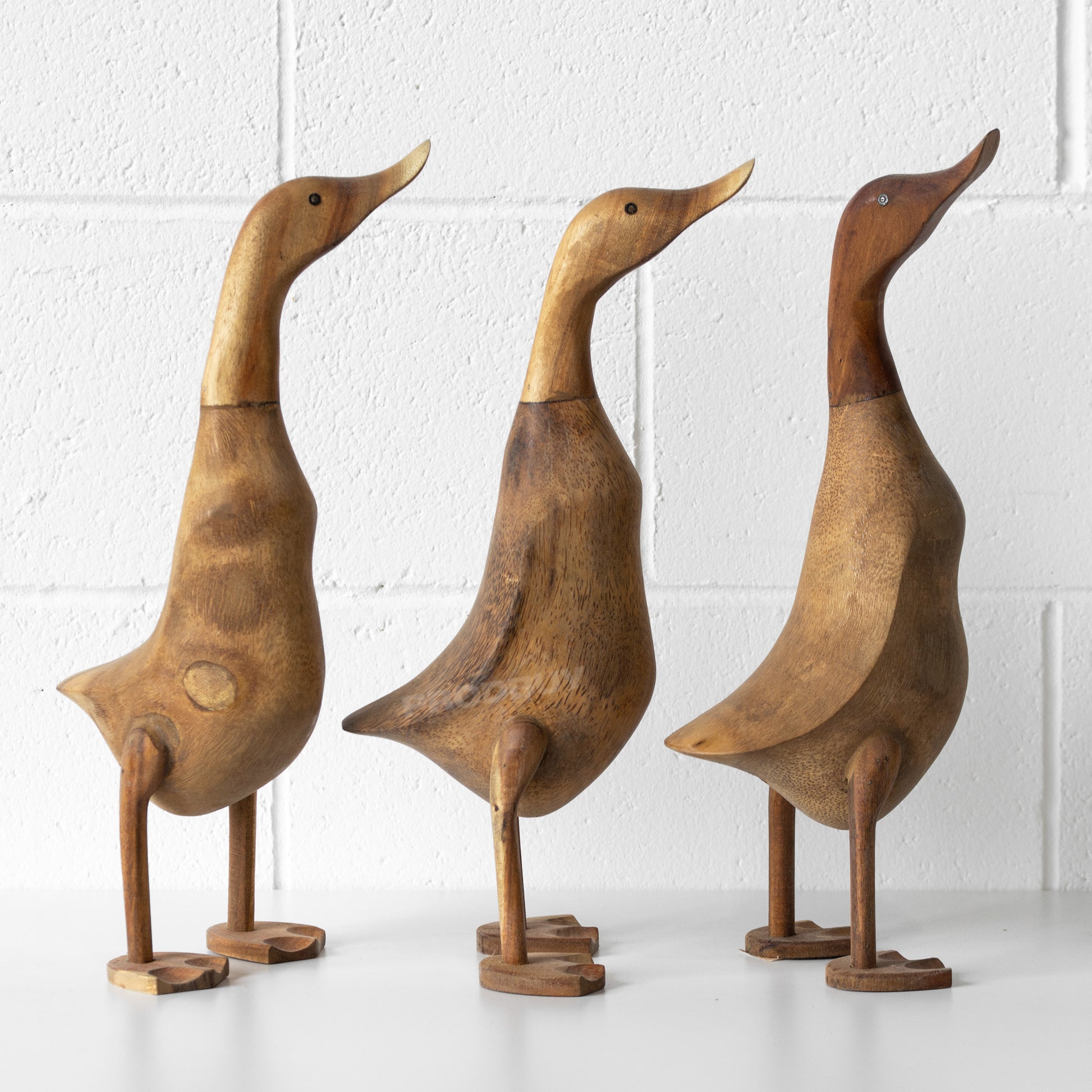 large wooden ducks