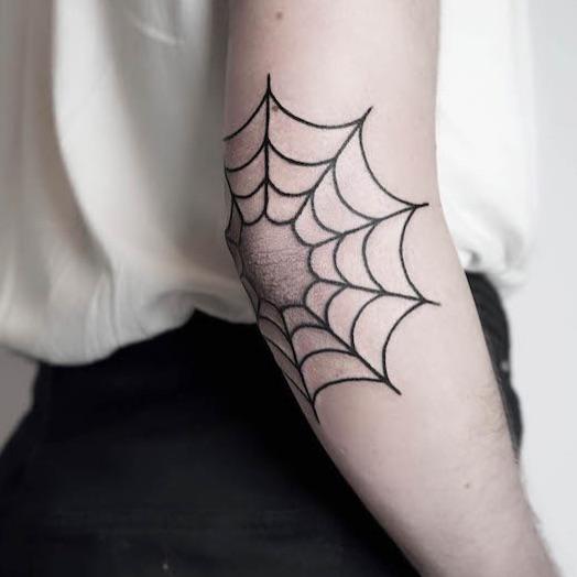 what does spider web tattoo on elbow mean