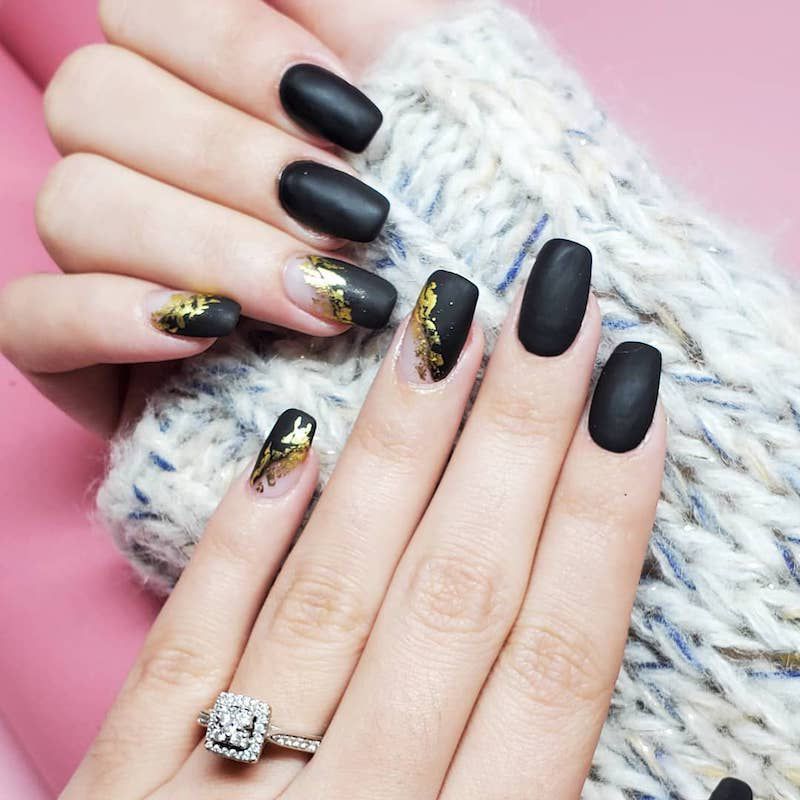 black nail polish with gold glitter