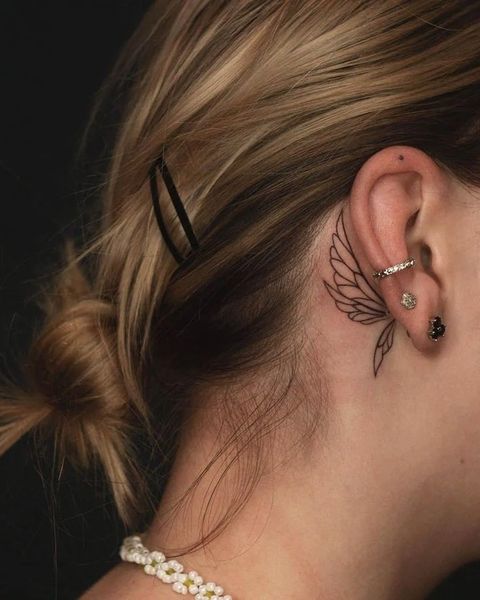 meaningful behind ear tattoos