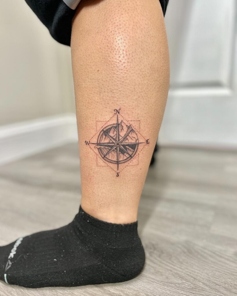 compass tattoo on leg