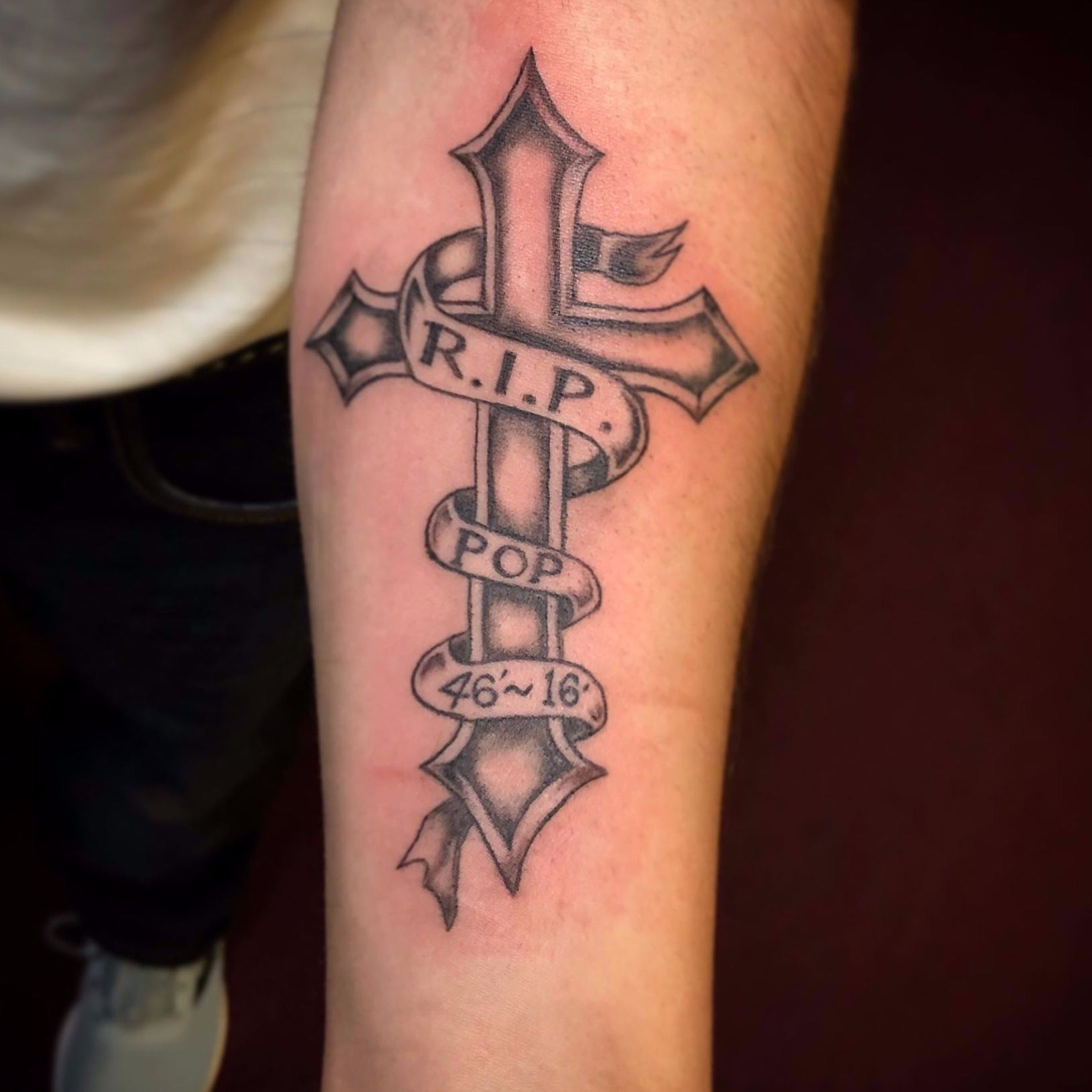 ribbon and cross tattoo