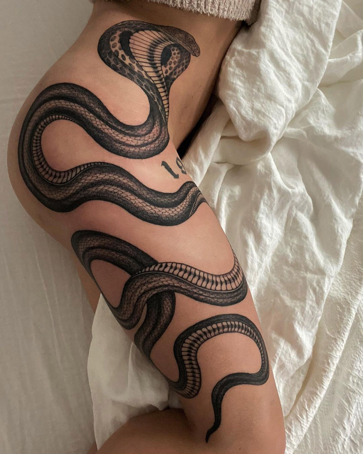 cobra tattoo on leg