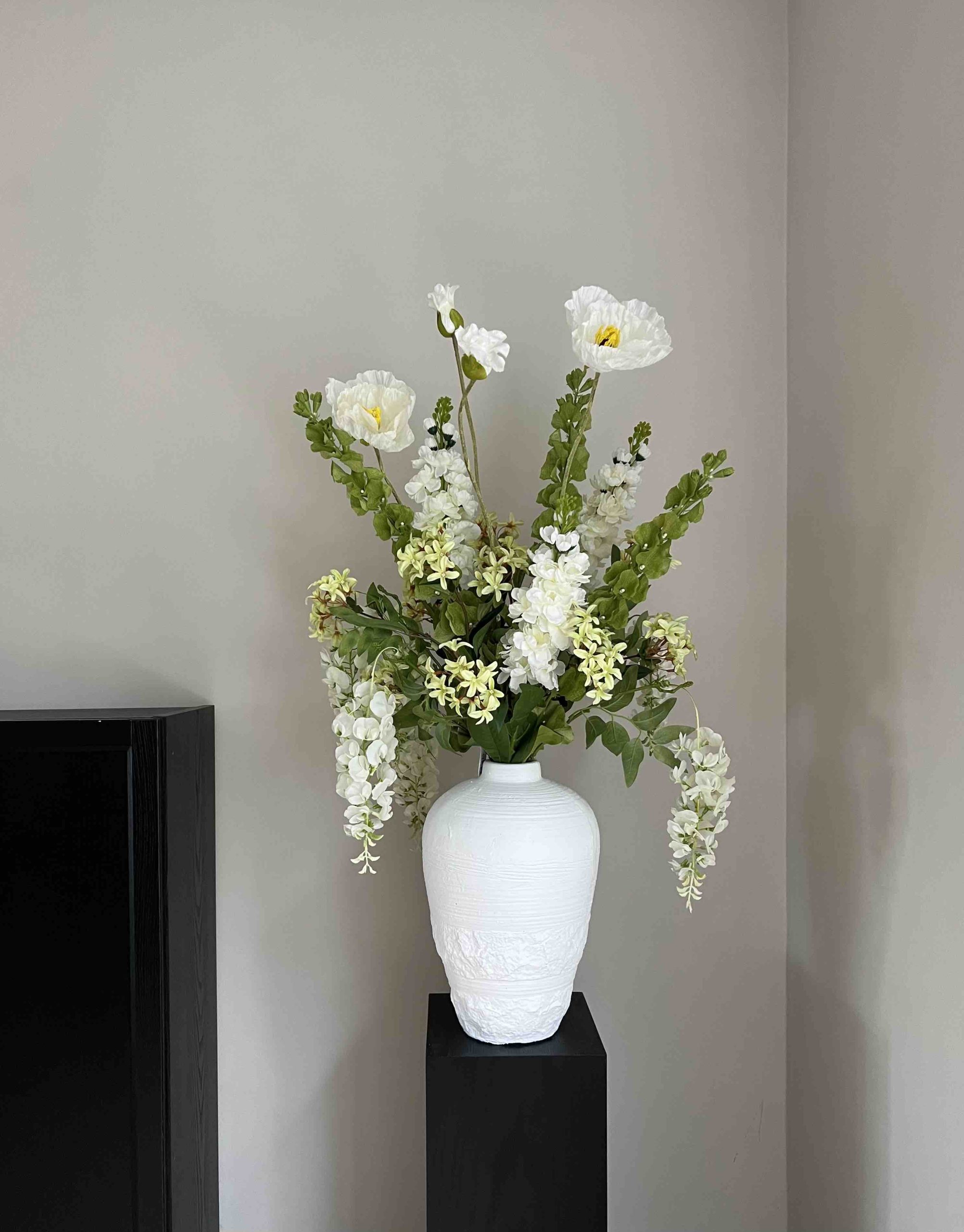 artificial flowers in large vase