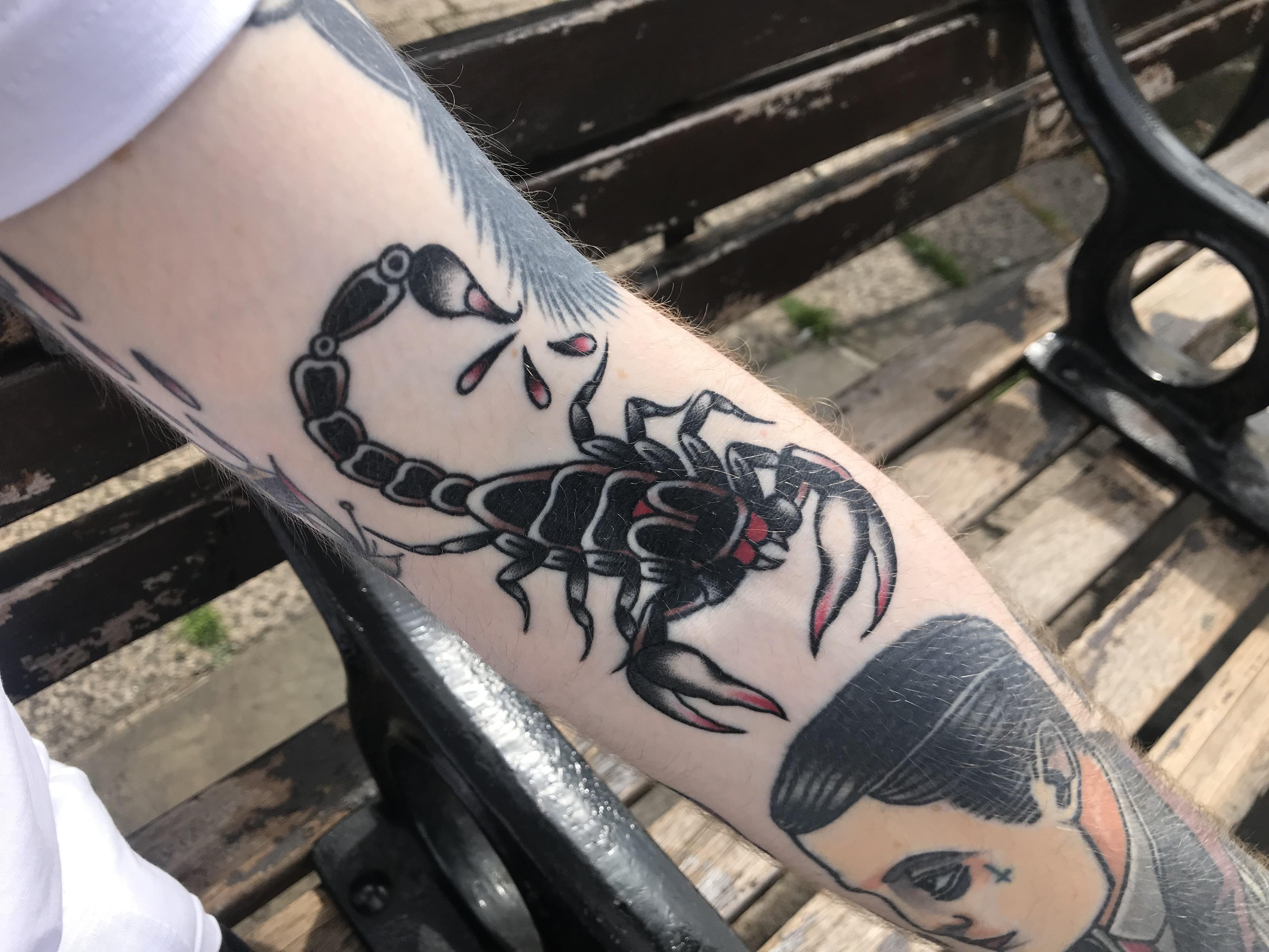 black traditional scorpion tattoo