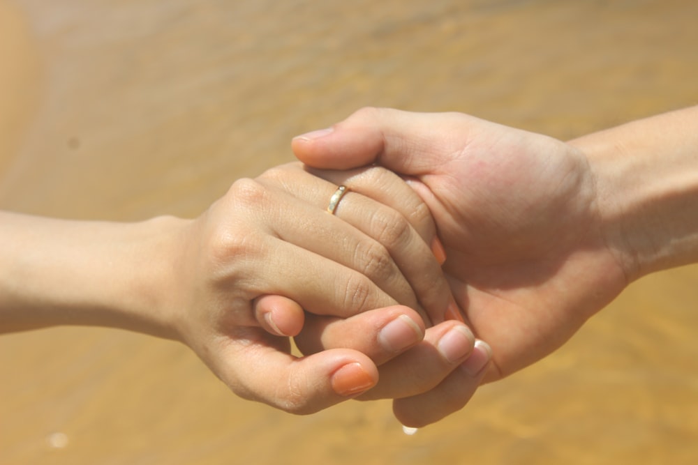 couple holding hands real images