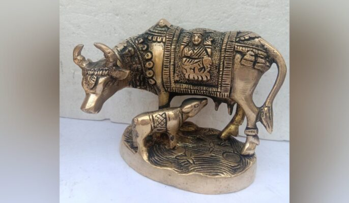 cow and calf statue in pooja room