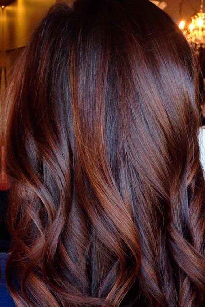 dark red brown hair with caramel highlights