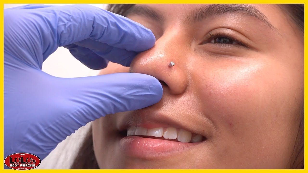 nose piercing by gun