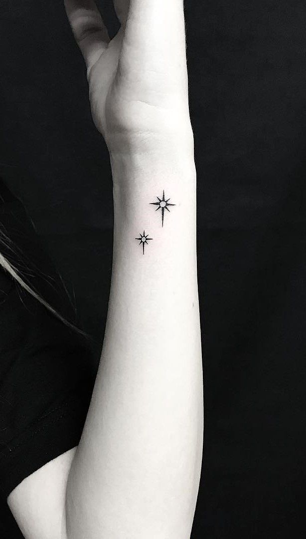 star tattoo on side wrist