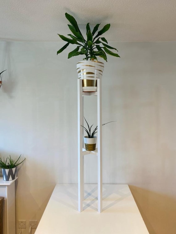 tall white plant stand