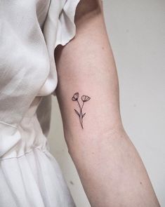 tiny poppy tattoo